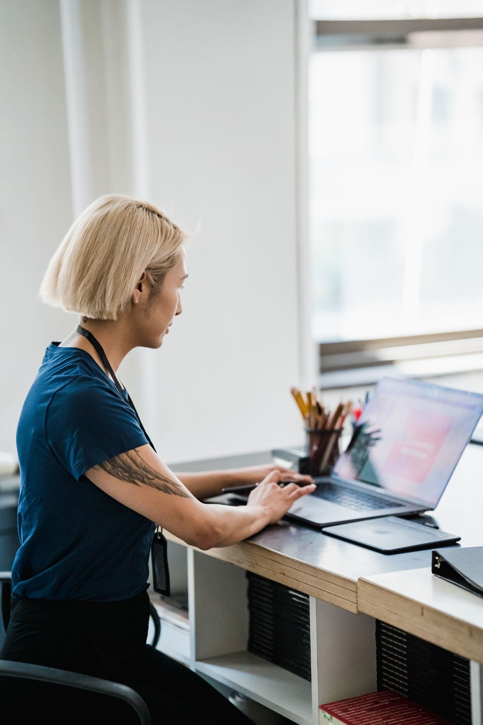 A professional working with digital tools in a modern workspace